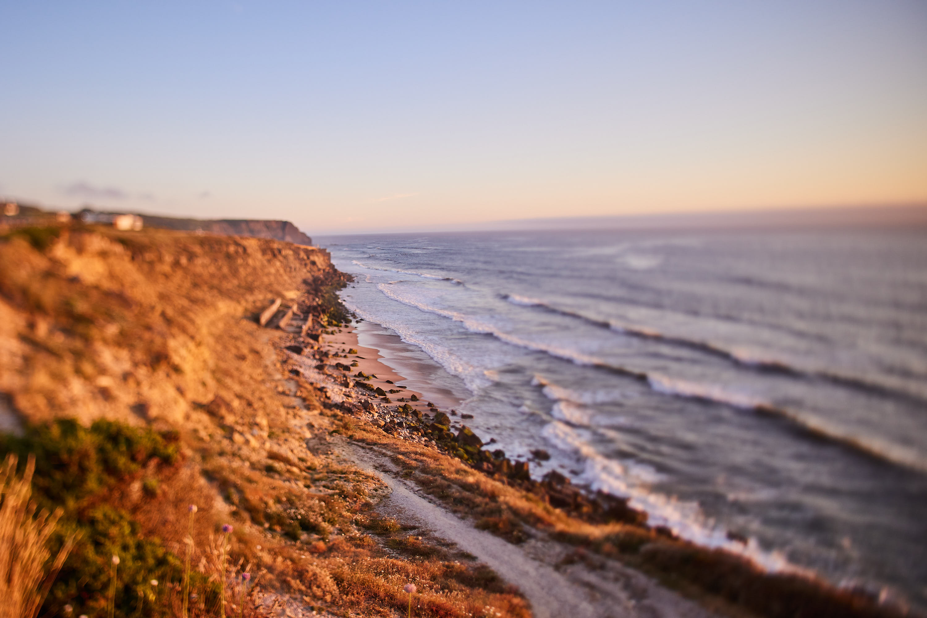 Golden-hour light along the coastal cliffs and the Atlantic
