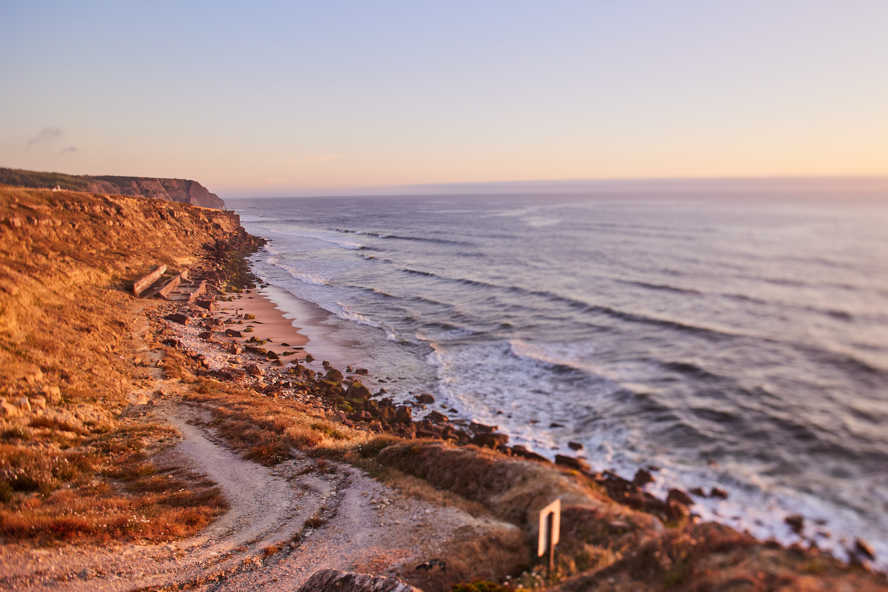 Evening light over the eroded cliffs and the ocean